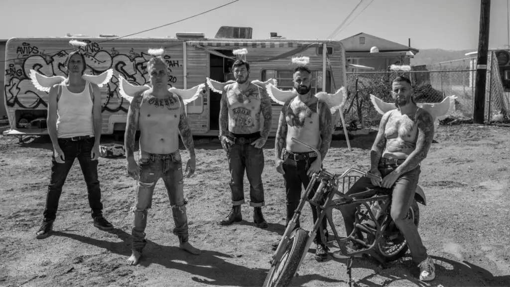 Avenged Sevenfold band members with angel wings in desert setting, official 2026 tour promo photo