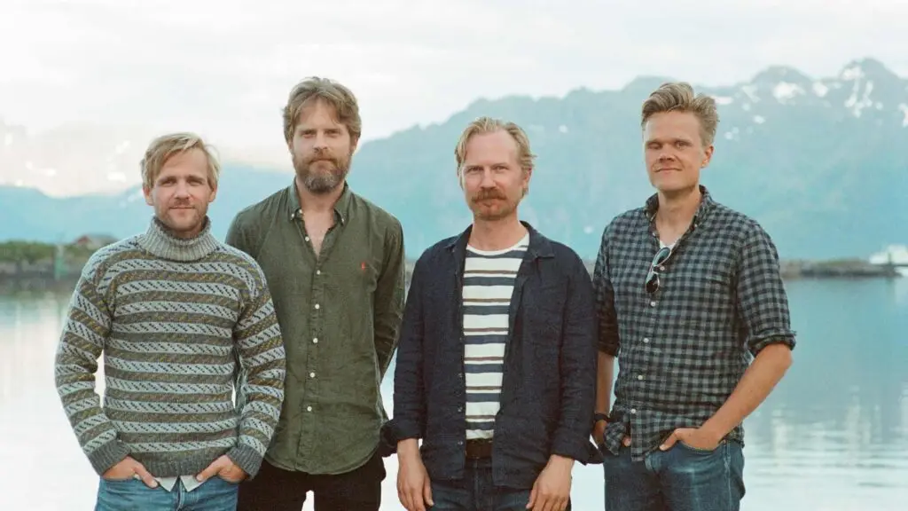 Danish String Quartet press photo: four musicians before a Norwegian fjord and mountain backdrop