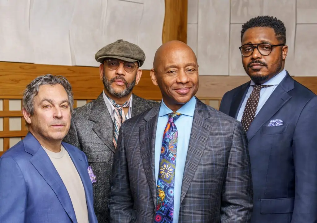 Branford Marsalis Quartet — four musicians in formal suits, studio press photo