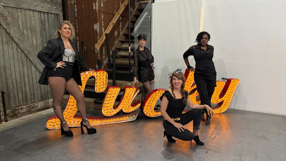 Classic Albums Live performers in Madonna-inspired outfits with Lucky Star marquee sign