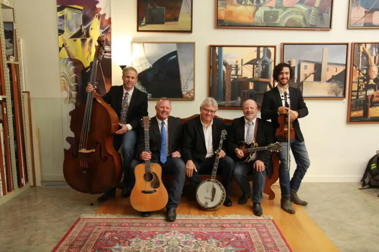 Rock Hearts bluegrass quintet press photo — five musicians with banjo, guitar, mandolin, upright bass, and fiddle