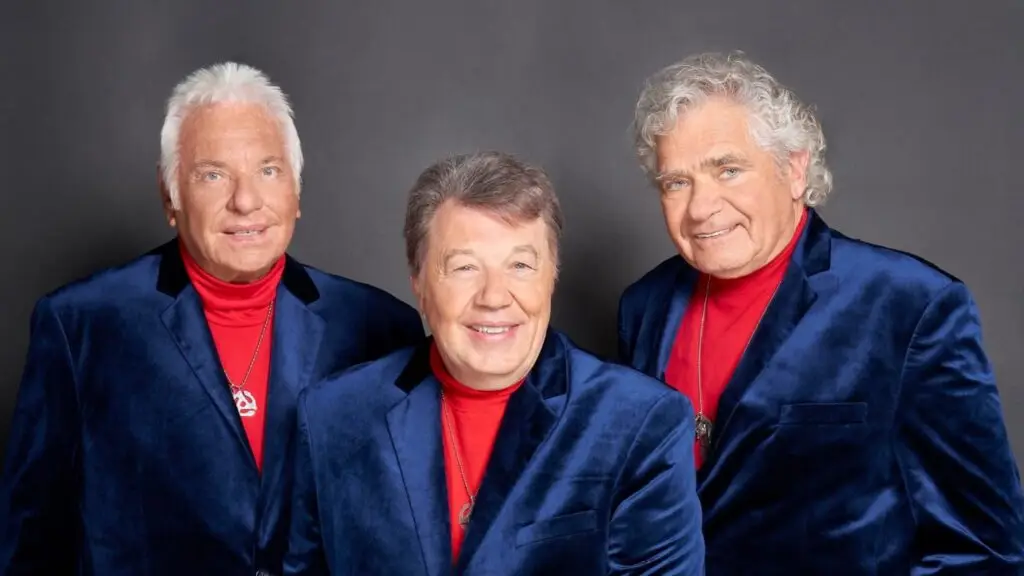 Jay & The Americans promotional photo, three members in matching blue velvet blazers and red turtlenecks