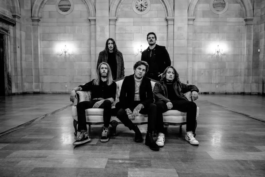 Midwinter five-piece band press photo in grand marble hall, black and white