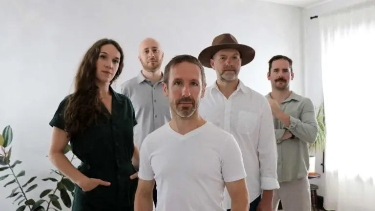 Driftwood five-piece folk rock band group press photo featuring violinist Claire Byrne