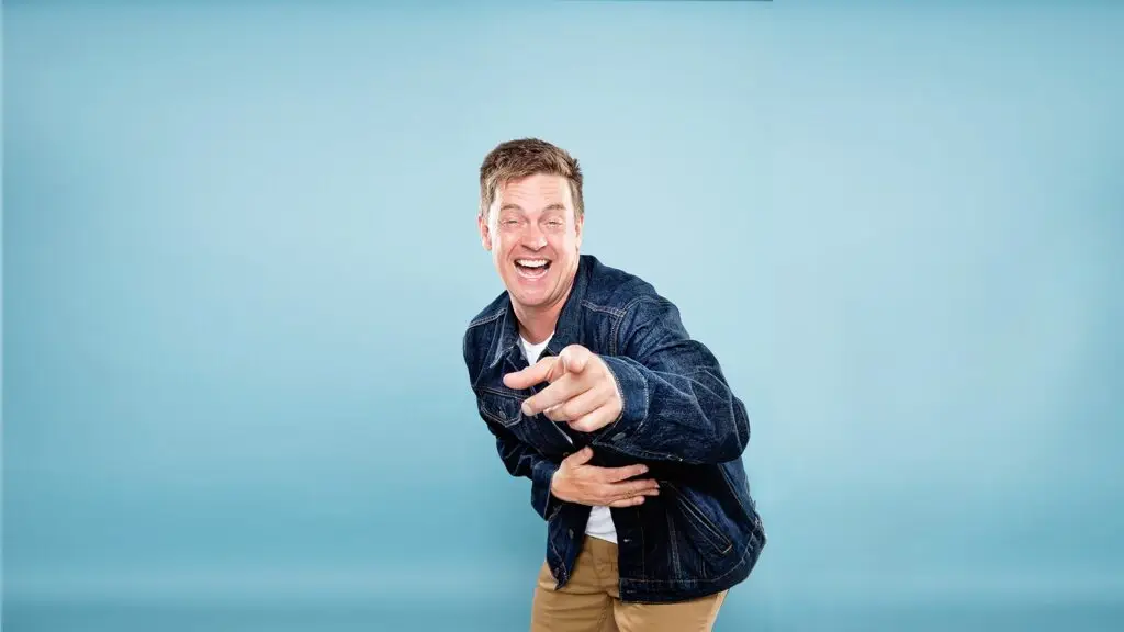 Jim Breuer laughing and pointing in a promotional press photo for his Find the Funny Tour 2026