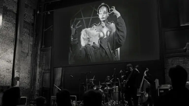 The Silent Light performing live beneath a projected silent film screen at EMPAC, Troy NY