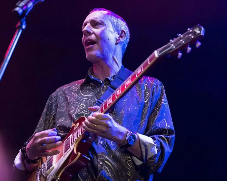 Joel Harrison performing live on stage with electric guitar at Colony Woodstock