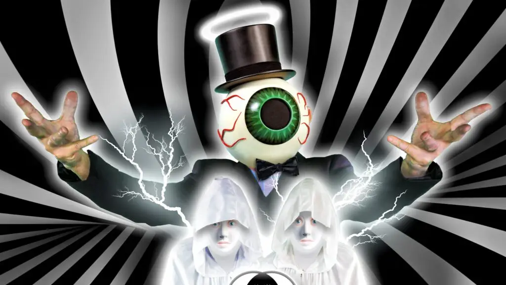 The Residents in their signature eyeball-head costumes performing live on stage