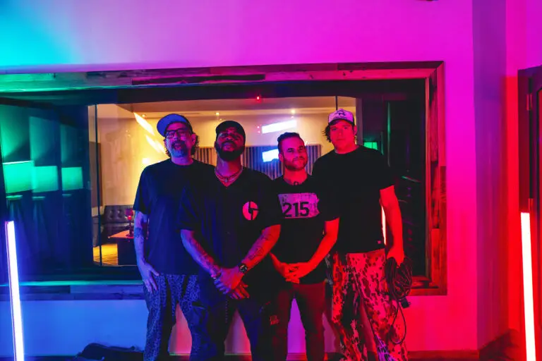The Disco Biscuits quartet in colorful neon-lit studio promo photo