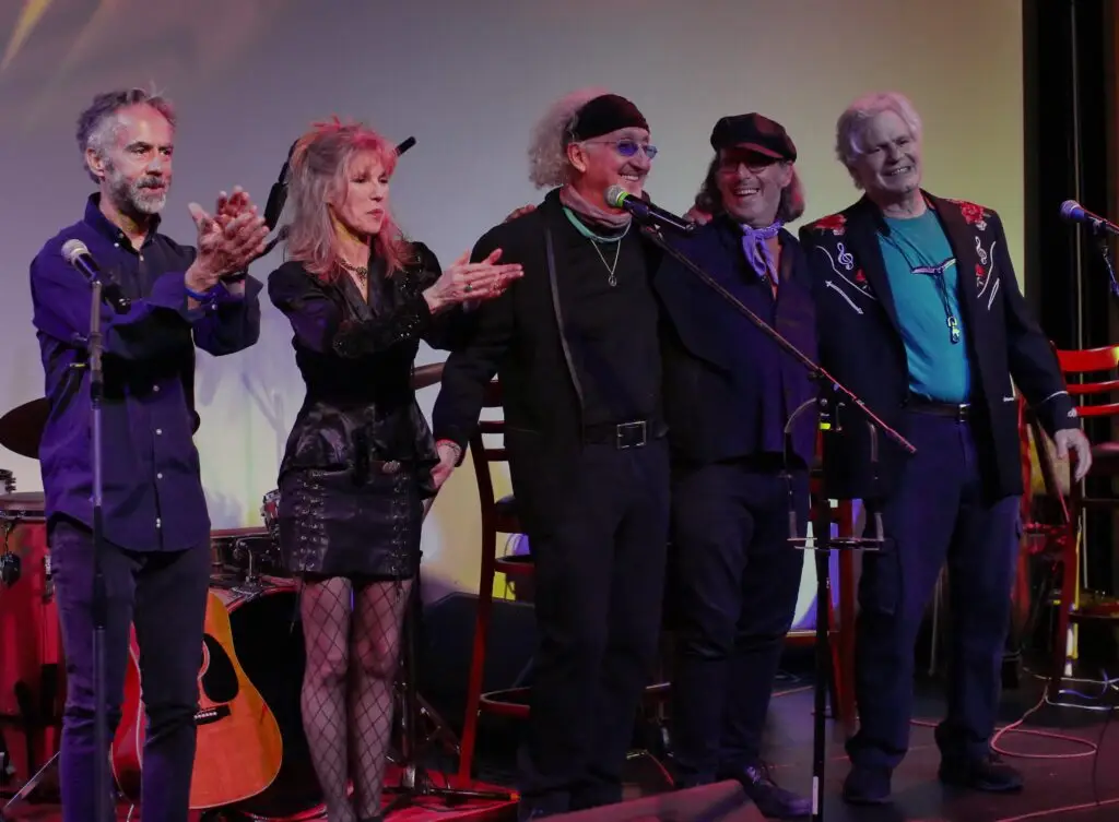 Aztec Two-Step 2.0 performing live on stage, Rex Fowler and Dodie Pettit lead the full band at curtain call