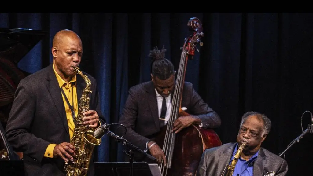 Eric Person and Houston Person performing live on stage with saxophones at a jazz concert