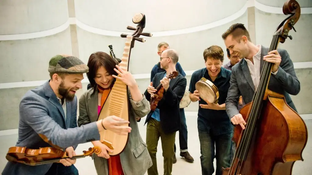 Silkroad Ensemble musicians performing with world instruments including pipa, violin, and double bass