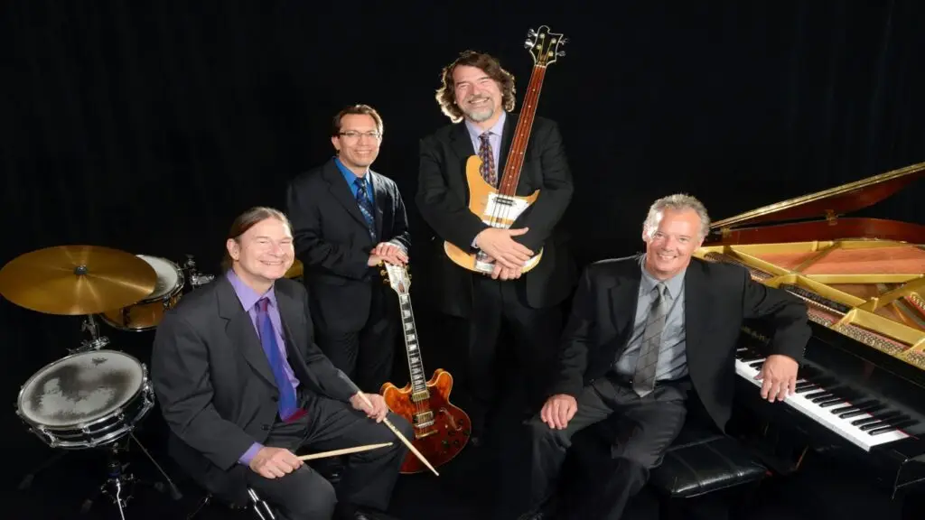 Brubeck Brothers Quartet promo photo: Dan, Chris Brubeck, Mike DeMicco, Chuck Lamb with instruments