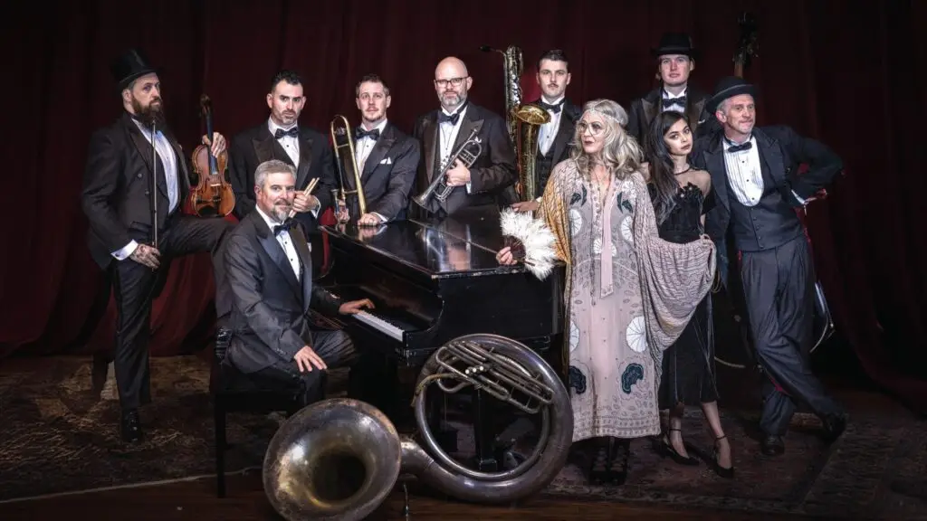 Squirrel Nut Zippers performing, full band in vintage vaudeville attire with sousaphone, brass, and piano
