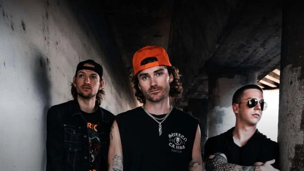 Eddie and the Getaway three-piece band press photo in industrial setting