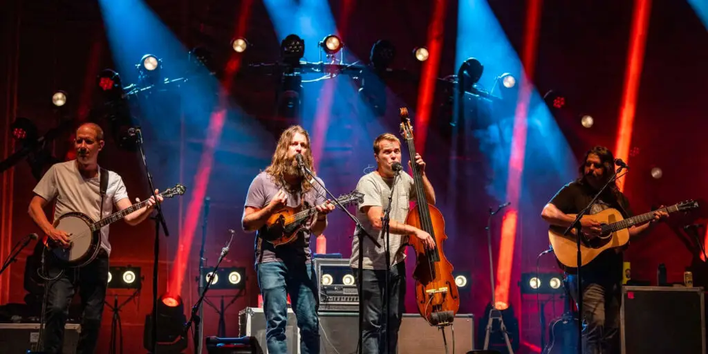 Greensky Bluegrass performing live on stage with dramatic red and blue stage lighting