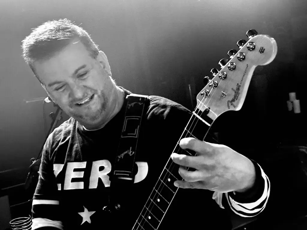 Drown guitarist performing live, wearing Smashing Pumpkins ZERO shirt, playing Fender guitar