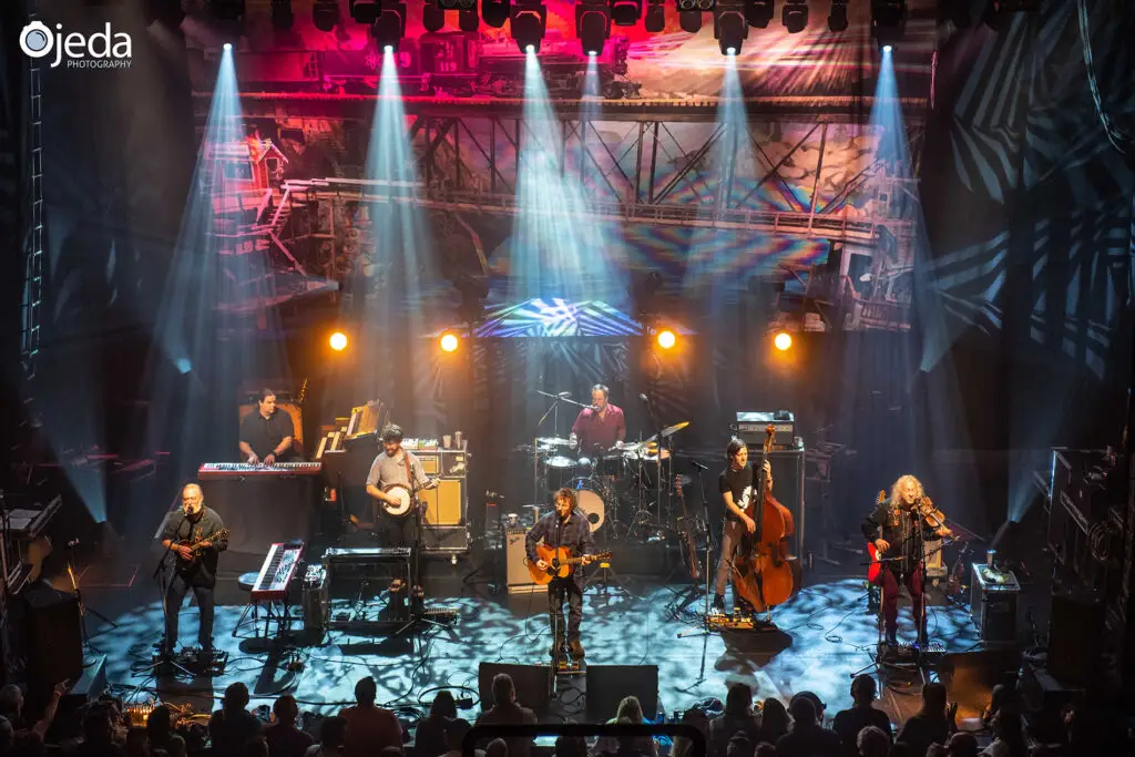 Railroad Earth performing live on stage, full seven-piece band with violin, banjo, and upright bass
