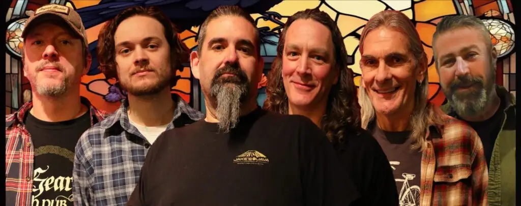 Dead Man's Waltz six-piece band, stained glass raven backdrop, 2026 promotional photo