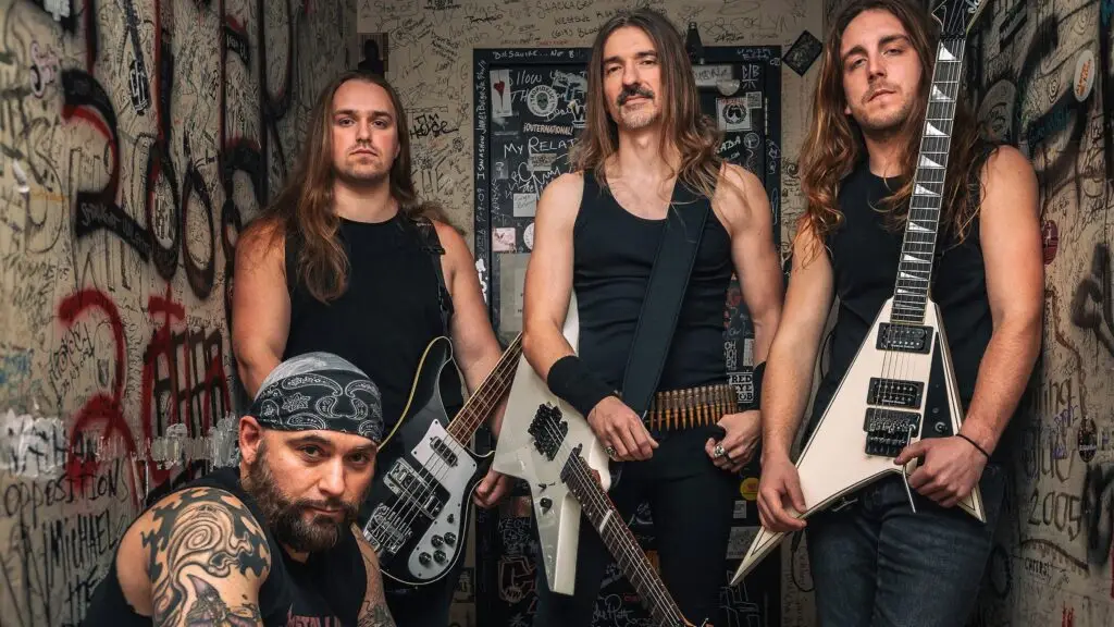 The Four Horsemen Metallica tribute band, four members with electric guitars in a graffiti-covered hallway