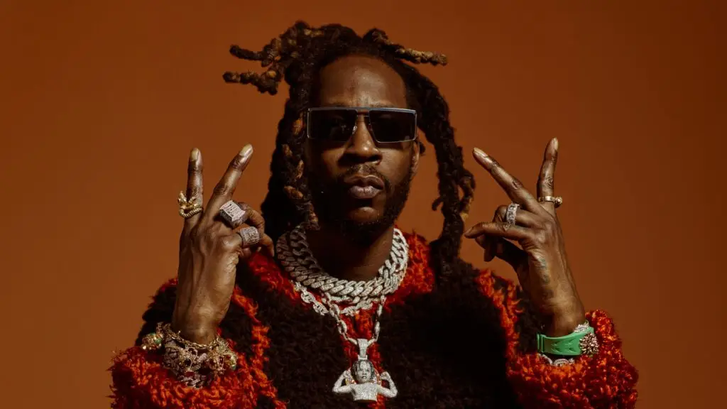 2 Chainz in official press photo wearing signature iced-out chains and diamond rings