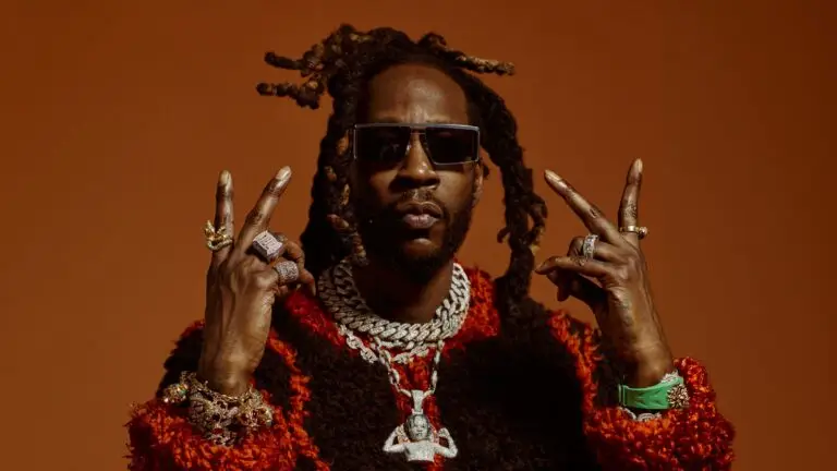 2 Chainz in official press photo wearing signature iced-out chains and diamond rings