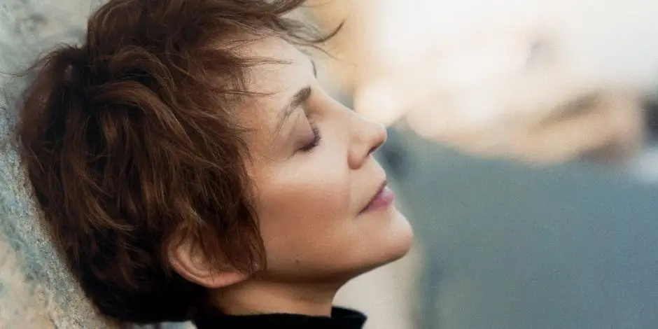 Stacey Kent in profile, eyes closed, resting against a stone wall — press photo for Peak Jazz Series at Caffè Lena