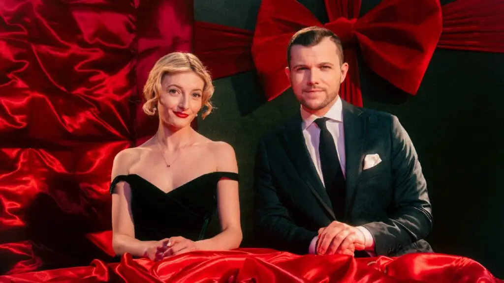 Caity Gyorgy and Christian Wiggs pose in formal attire for Swing into the Holidays holiday jazz show