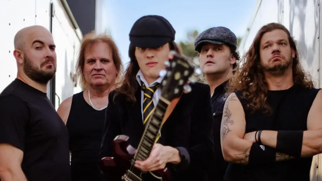 Thunderstruck: America's AC/DC Tribute, five-piece band promotional photo with Angus Young-costumed guitarist