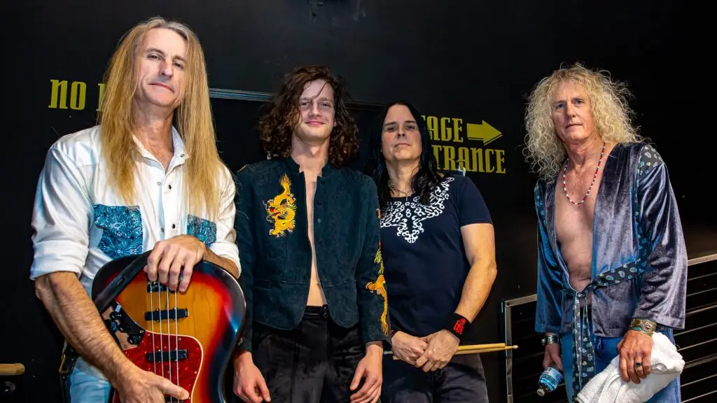ZOSO, Led Zeppelin tribute band, four members posed backstage before a performance