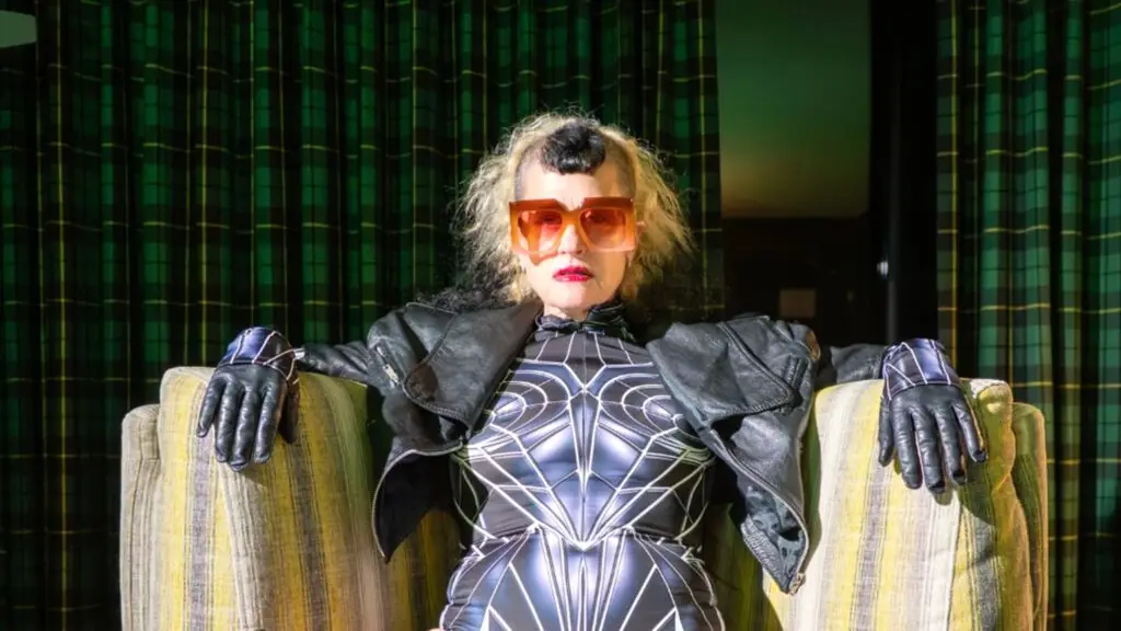 Peaches in black spiderweb bodysuit and oversized sunglasses for the No Lube So Rude Tour
