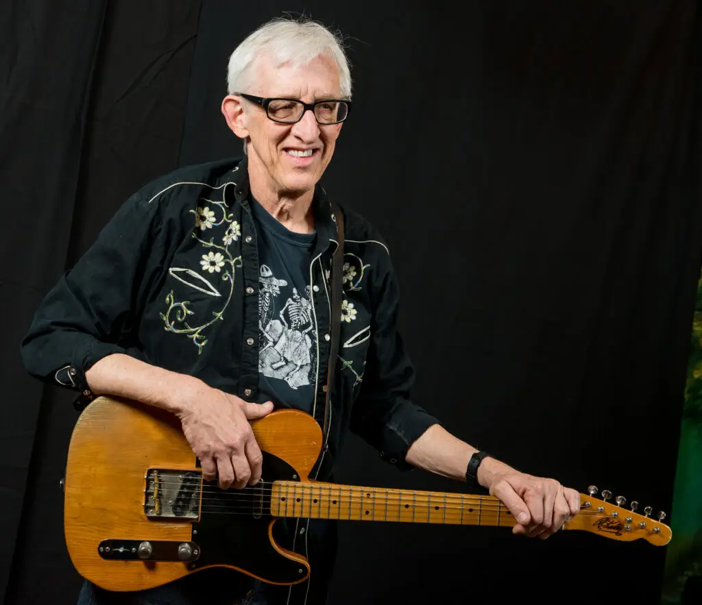 Bill Kirchen playing his Telecaster guitar, official press photo