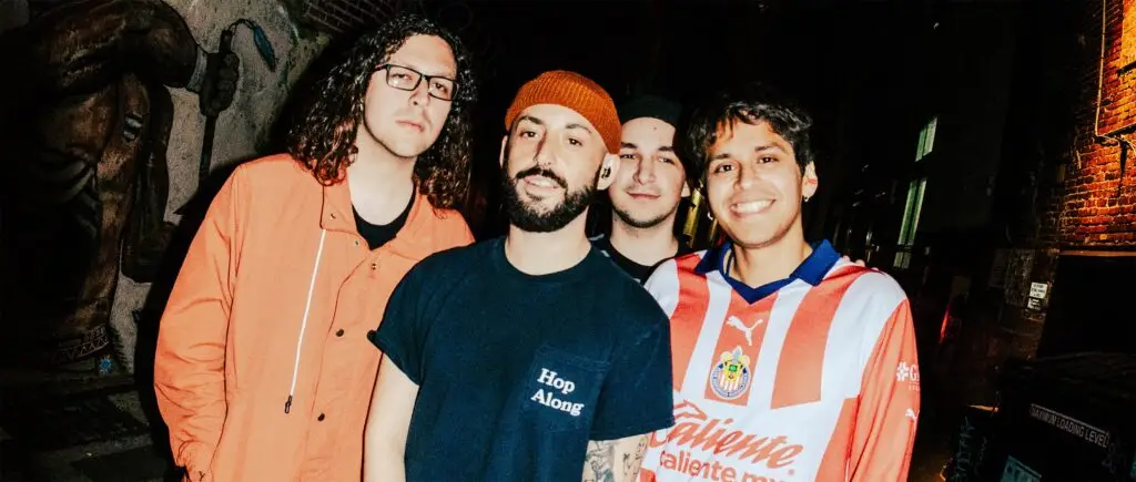 Oso Oso band members pose in an urban alley, official 2026 press photo