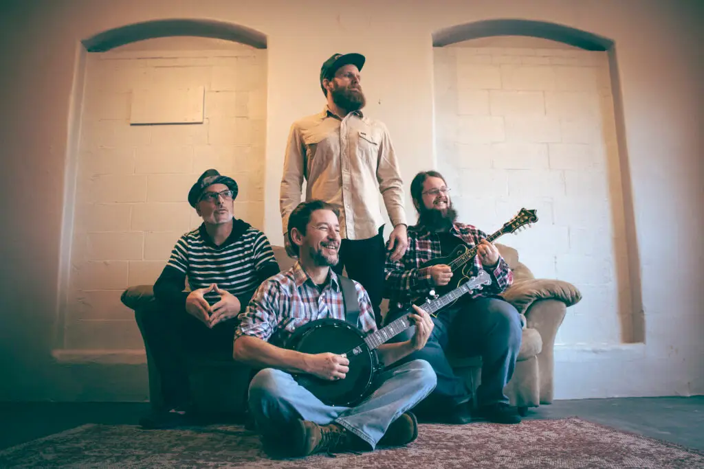 Smilo & the Ghost four-piece band with banjo and mandolin, 2026 promo photo