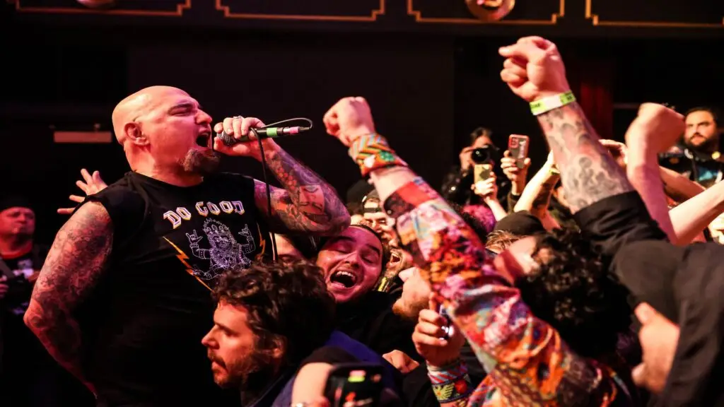 Murphy's Law frontman Jimmy Gestapo screaming into mic above surging crowd during live hardcore set