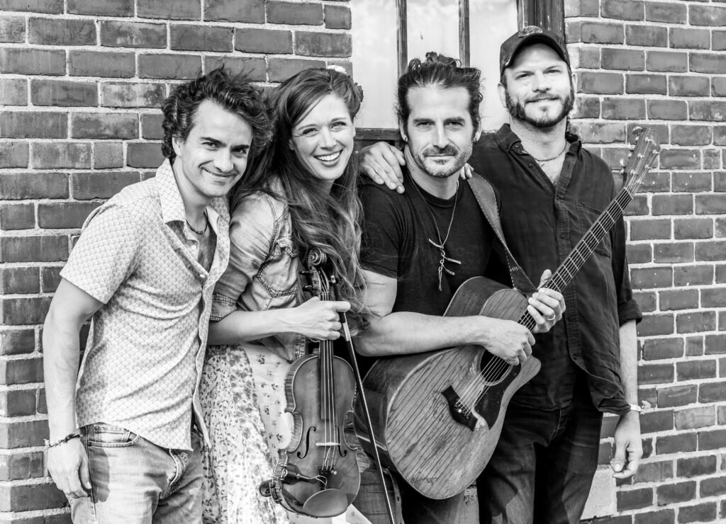 Adam Ezra Group — Corinna Smith on fiddle, Adam Ezra on guitar, in official band press photo