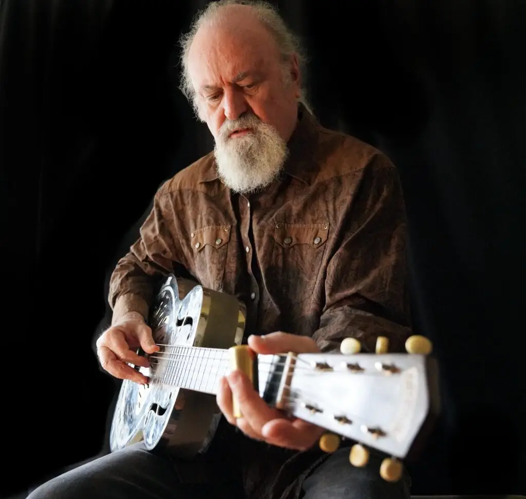 Tinsley Ellis playing a National Steel resonator guitar, studio press photo