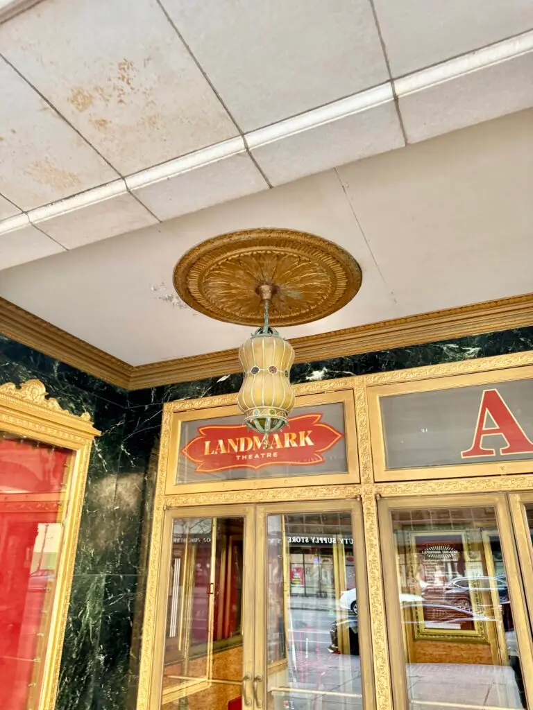 Gold leaf, green marble and a decorative ceiling medallion in the Landmark Theatre entrance vestibule