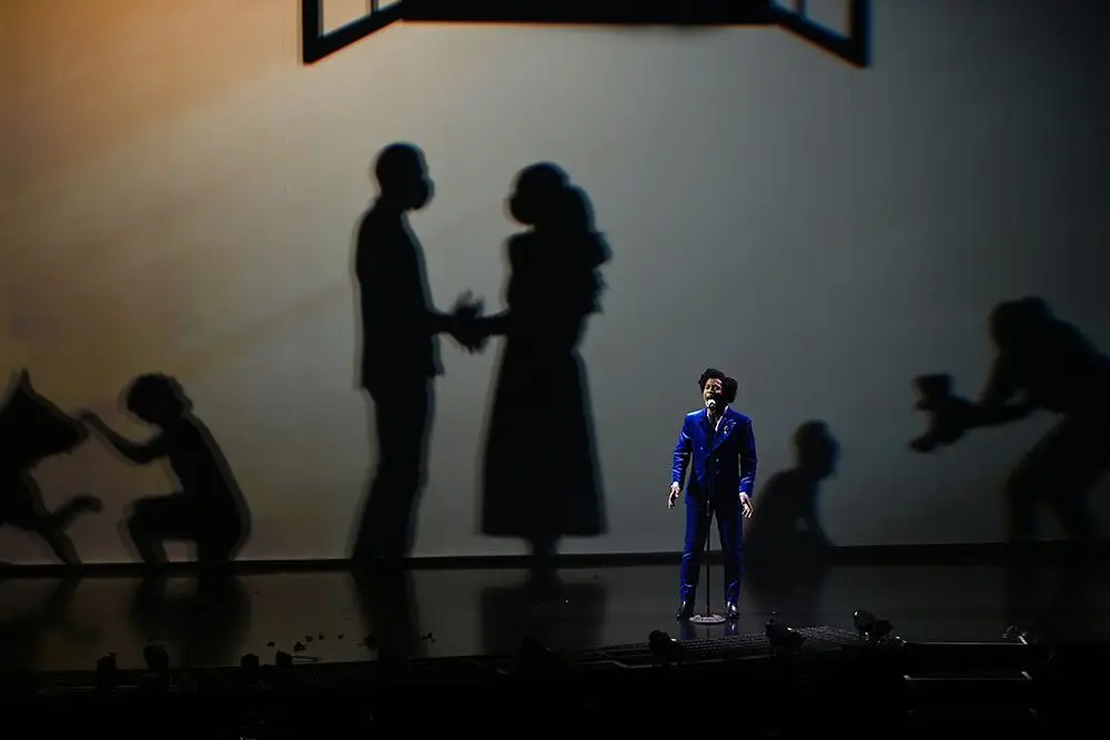 The Silhouettes performing live shadow dance in their LOVE Happens production