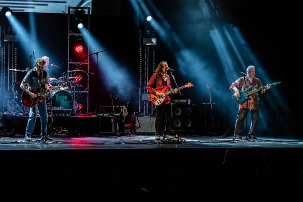 Green River performing live on stage, four-piece CCR and John Fogerty tribute band with dramatic stage lighting