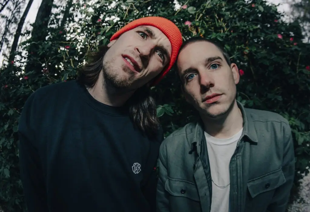 Eazybaked duo Eric Ray and Andrew Principe in outdoor press photo, green foliage background