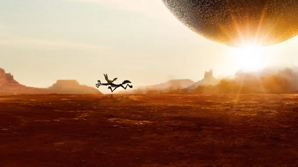 Wile E. Coyote sprinting across a red-rock desert canyon as a giant ACME boulder rolls toward him