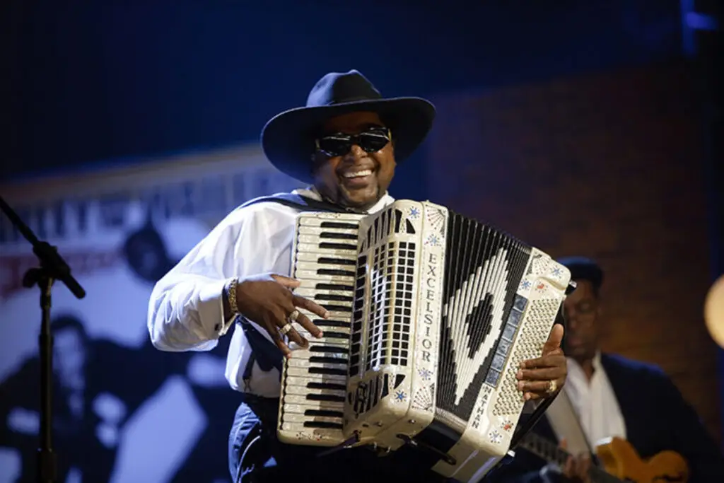 Nathan Williams of Nathan & the Zydeco Cha Chas performing live with accordion on stage