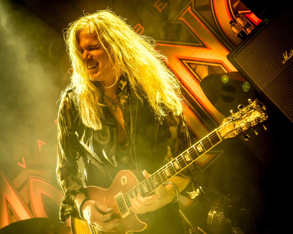 Adrian Vandenberg plays guitar on stage during the My Whitesnake Years Tour