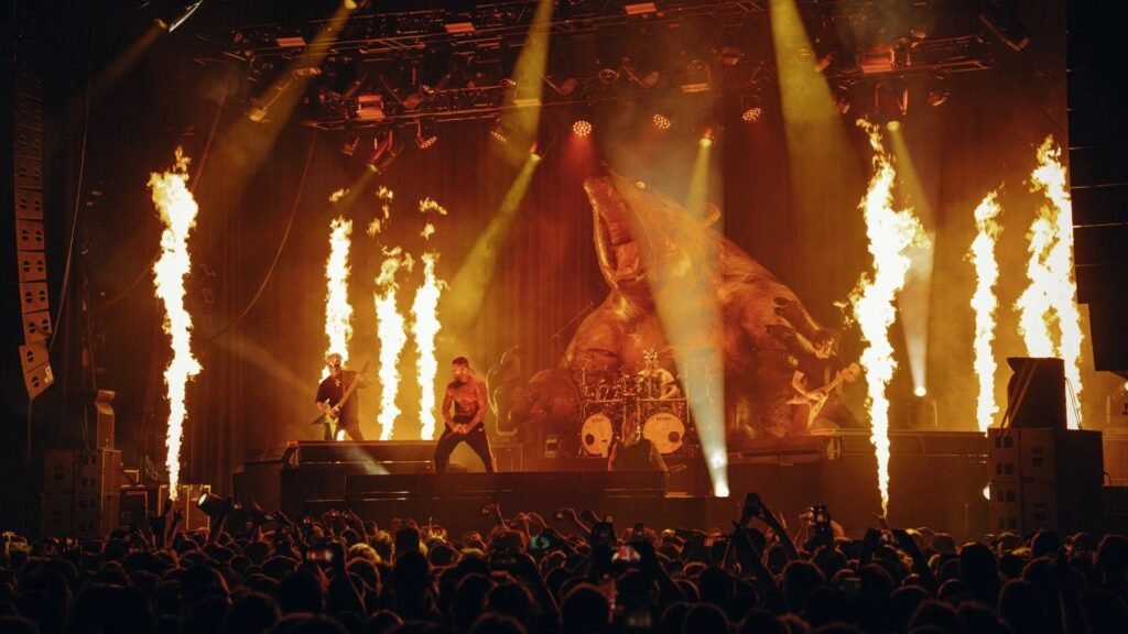 Slaughter to Prevail performing live on the GRIZZLY tour, with fire columns and bear prop stage backdrop