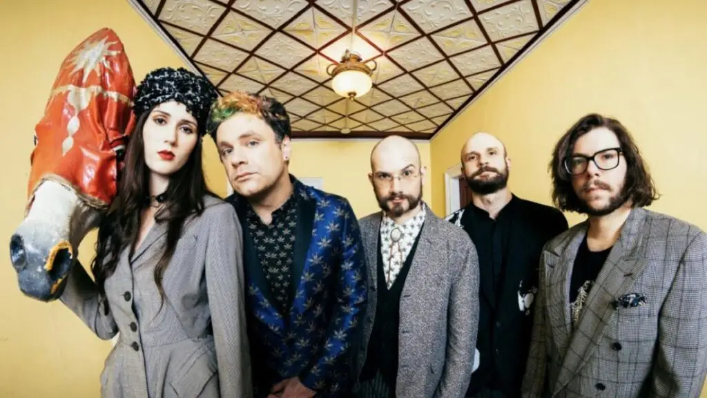 Ecce Shnak five-piece band in theatrical press photo with horse head prop, photo by Rose Callahan