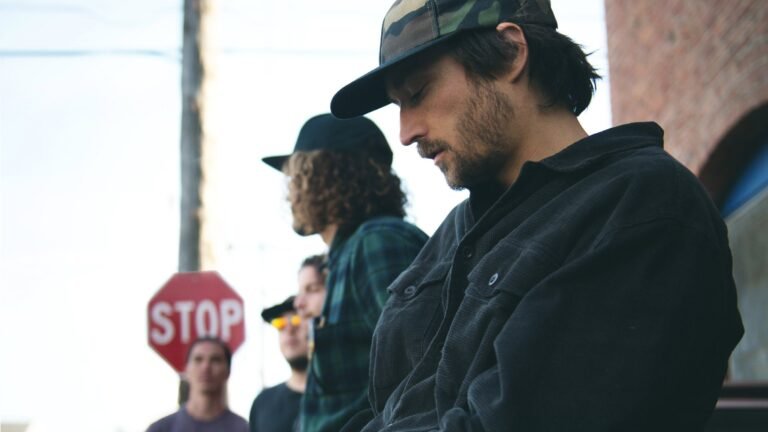 Stick Figure band members posed on an outdoor city street, official press photo