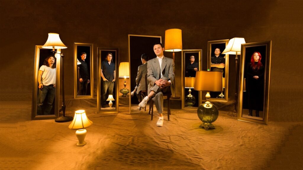 Start Making Sense Talking Heads tribute band posed in artistic mirror and lamp concept press photo