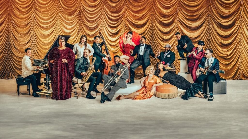 Scott Bradlee's Postmodern Jukebox ensemble in vintage formal attire, promotional press photo