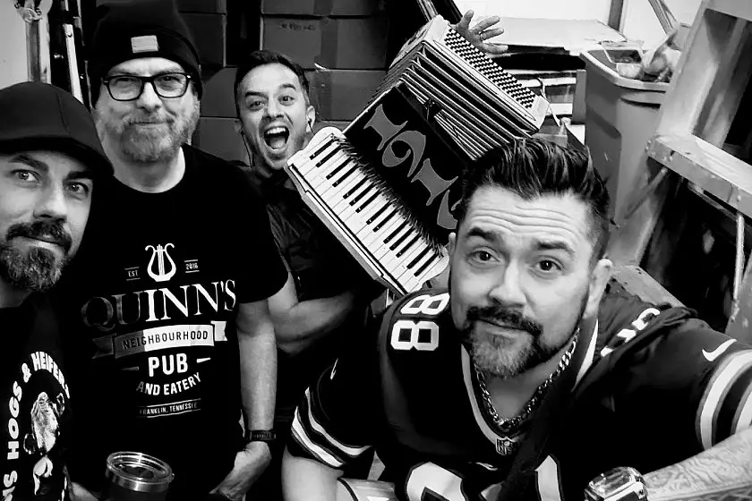 1916 Celtic punk band members backstage with accordion, Rochester NY